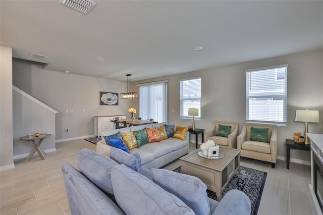 7709 Imagination Pl, Wesley Chapel, FL 33545 - living area with baseboards and wood tiled floors
