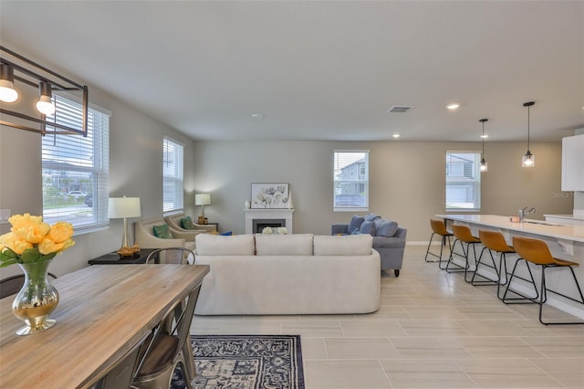 7709 Imagination Pl, Wesley Chapel, FL 33545 - living room with recessed lighting and a fireplace
