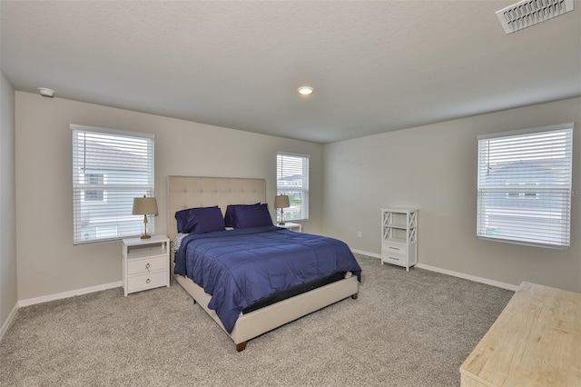 7709 Imagination Pl, Wesley Chapel, FL 33545 - carpeted bedroom with baseboards