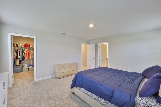 7709 Imagination Pl, Wesley Chapel, FL 33545 - bedroom with a walk in closet, carpet, a closet, baseboards, and recessed lighting