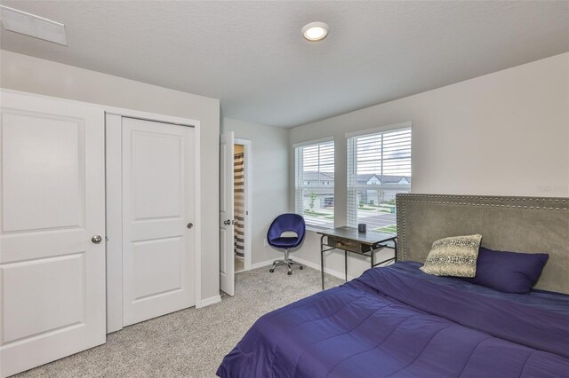 7709 Imagination Pl, Wesley Chapel, FL 33545 - carpeted bedroom with baseboards and a closet