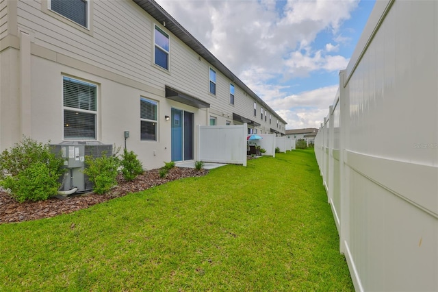 7709 Imagination Pl, Wesley Chapel, FL 33545 - rear view of property featuring central AC unit