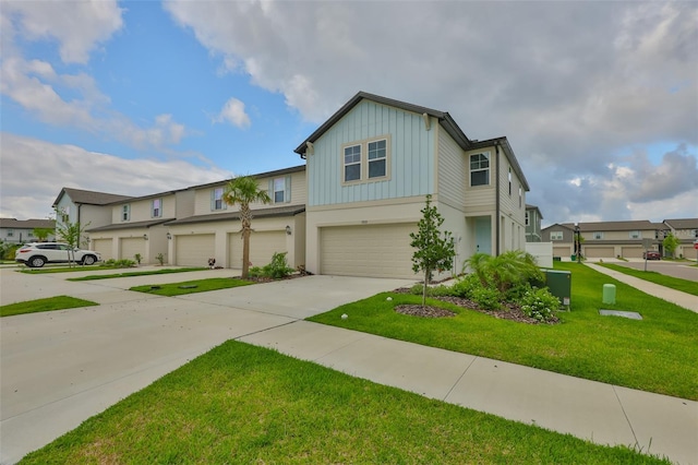 7709 Imagination Pl, Wesley Chapel, FL 33545 - view of property featuring board and batten siding, a garage, a residential view, driveway, and a front yard