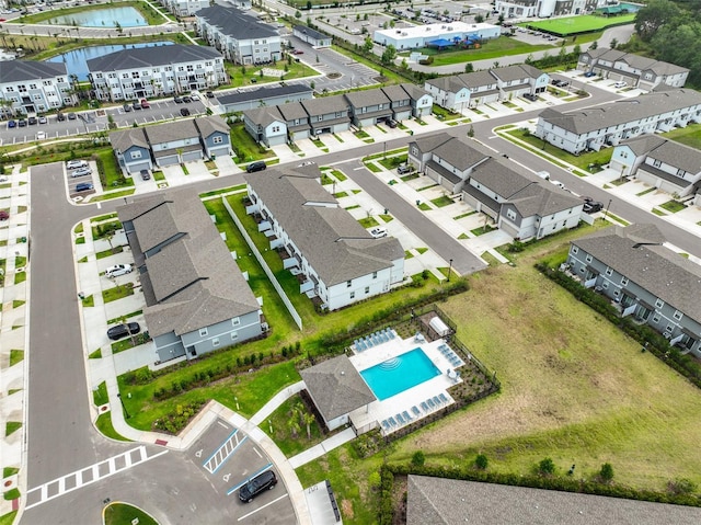 7709 Imagination Pl, Wesley Chapel, FL 33545 - aerial perspective of suburban area featuring a pool and a nearby body of water