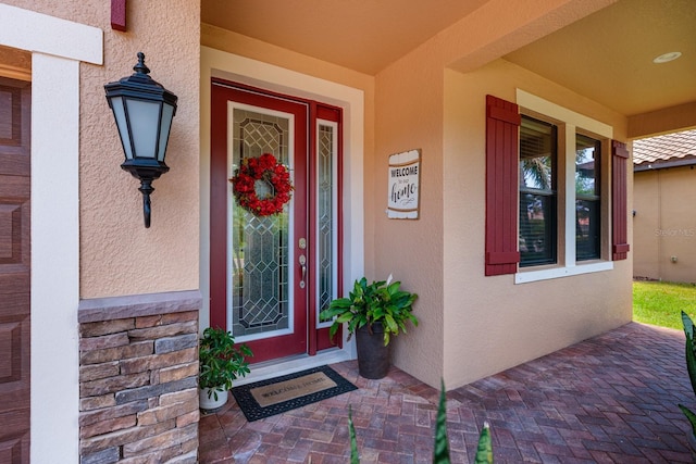 4611 Grand Preserve Pl, Palm Harbor, FL 34684 - entrance to property with stucco siding and covered porch