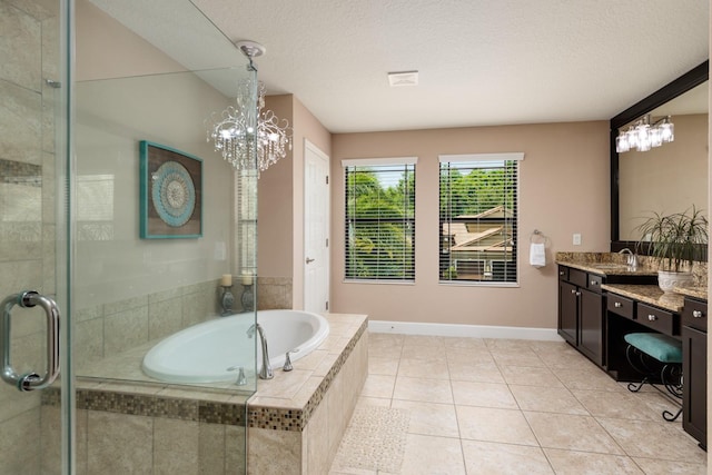 4611 Grand Preserve Pl, Palm Harbor, FL 34684 - bathroom with a chandelier, vanity, a garden tub, tiled shower, and baseboards