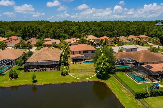 4611 Grand Preserve Pl, Palm Harbor, FL 34684 - aerial perspective of suburban area with a pool area, a large body of water, and a heavily wooded area