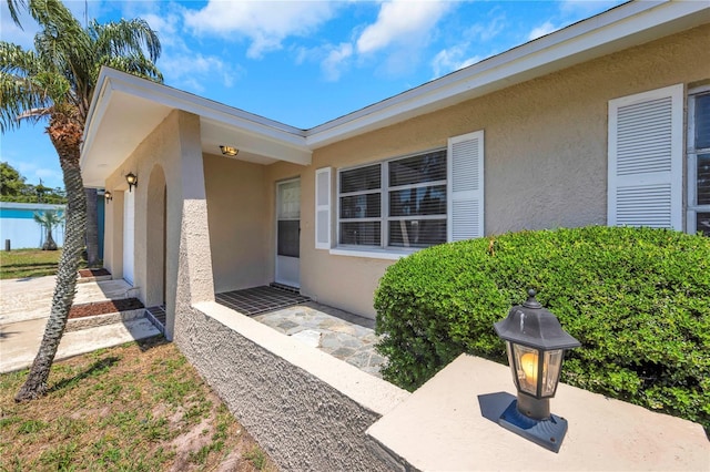 204 Cove Ct, Clearwater, FL 33756 - property entrance featuring stucco siding