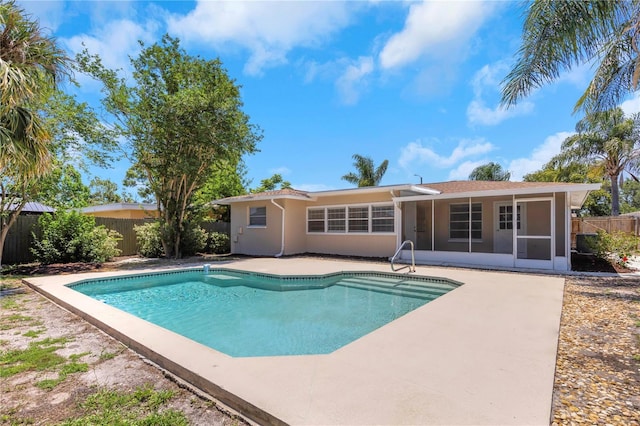 204 Cove Ct, Clearwater, FL 33756 - view of pool with a sunroom, a fenced backyard, and a patio area