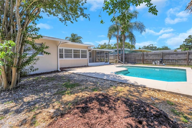 204 Cove Ct, Clearwater, FL 33756 - view of pool with a sunroom, a fenced backyard, and a patio area