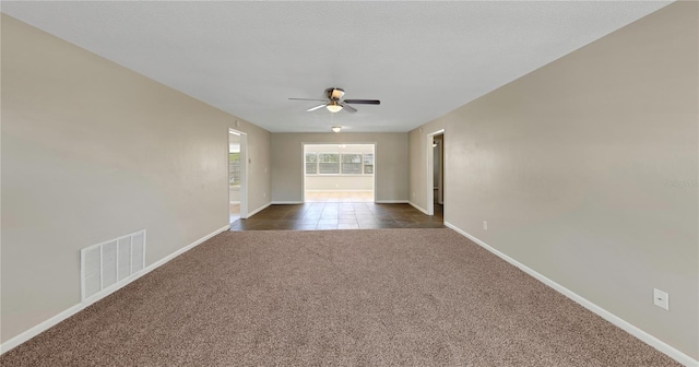 204 Cove Ct, Clearwater, FL 33756 - spare room with ceiling fan, dark carpet, and baseboards