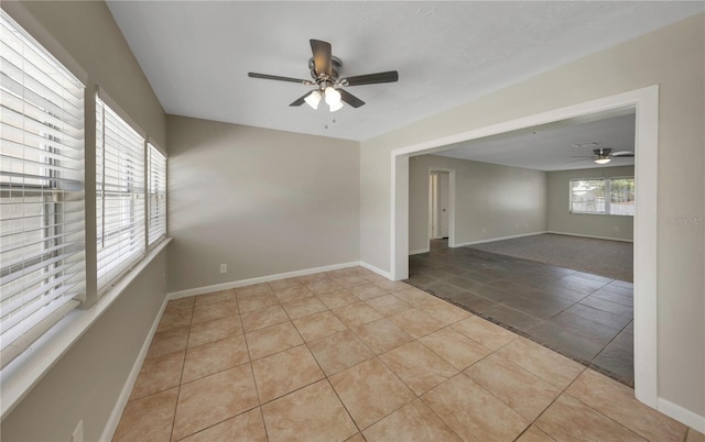 204 Cove Ct, Clearwater, FL 33756 - spare room featuring ceiling fan, tile patterned flooring, and baseboards