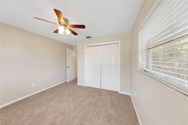 204 Cove Ct, Clearwater, FL 33756 - unfurnished bedroom with carpet flooring, baseboards, a closet, and a ceiling fan