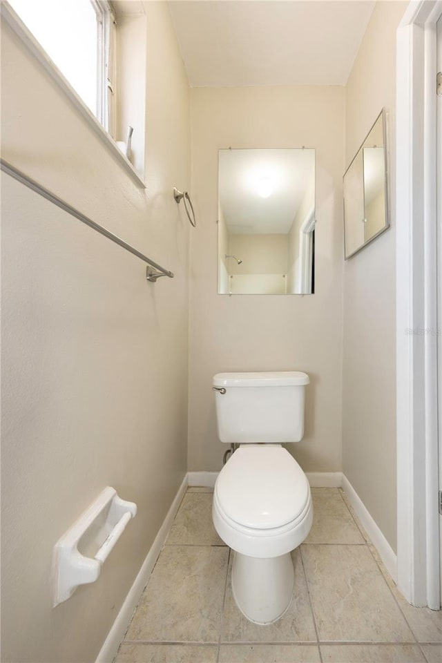 204 Cove Ct, Clearwater, FL 33756 - bathroom featuring toilet, baseboards, and tile patterned flooring