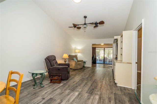 35145 Whispering Oaks Blvd, Dade City, FL 33523 - living area with lofted ceiling, dark wood finished floors, baseboards, and a ceiling fan