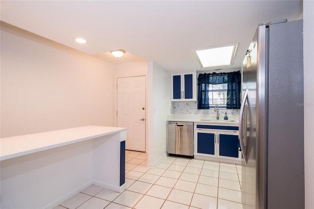 35145 Whispering Oaks Blvd, Dade City, FL 33523 - kitchen with appliances with stainless steel finishes, a sink, light countertops, and light tile patterned floors