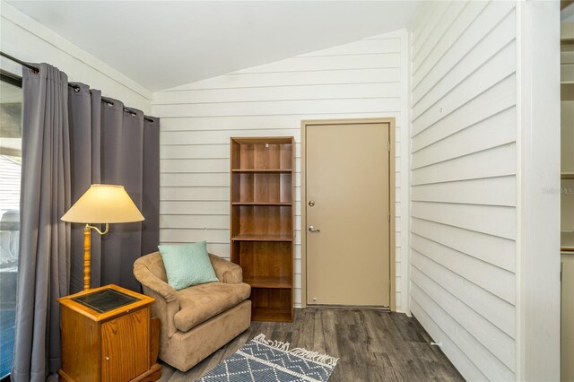 35145 Whispering Oaks Blvd, Dade City, FL 33523 - living area featuring vaulted ceiling, wood finished floors, and wooden walls