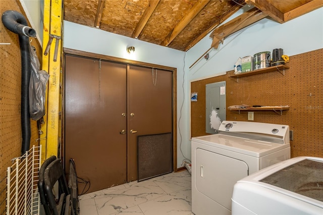 35145 Whispering Oaks Blvd, Dade City, FL 33523 - washroom featuring separate washer and dryer, electric panel, and light marble finish flooring