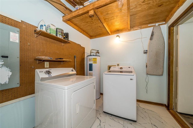 35145 Whispering Oaks Blvd, Dade City, FL 33523 - laundry room with water heater, electric panel, light marble finish flooring, and separate washer and dryer