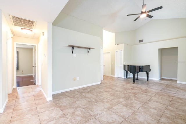 748 Sagewood Dr, Lakeland, FL 33813 - unfurnished living room with light tile patterned flooring, high vaulted ceiling, a ceiling fan, and baseboards