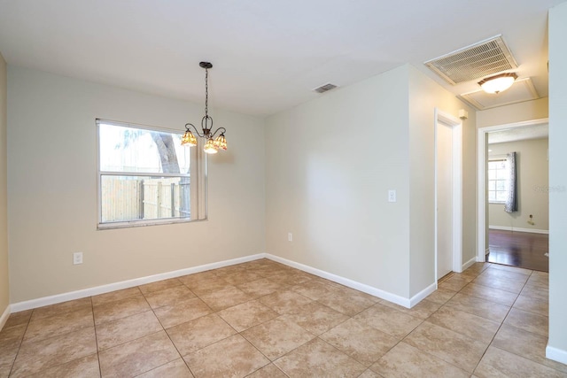 748 Sagewood Dr, Lakeland, FL 33813 - unfurnished room with baseboards, light tile patterned flooring, and a chandelier