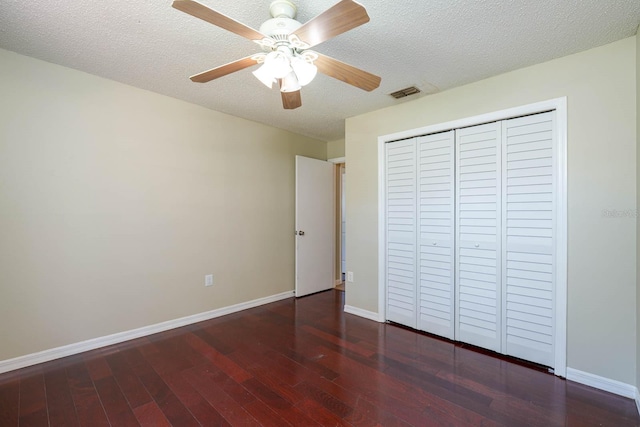 748 Sagewood Dr, Lakeland, FL 33813 - unfurnished bedroom with wood finished floors, baseboards, a closet, a textured ceiling, and a ceiling fan