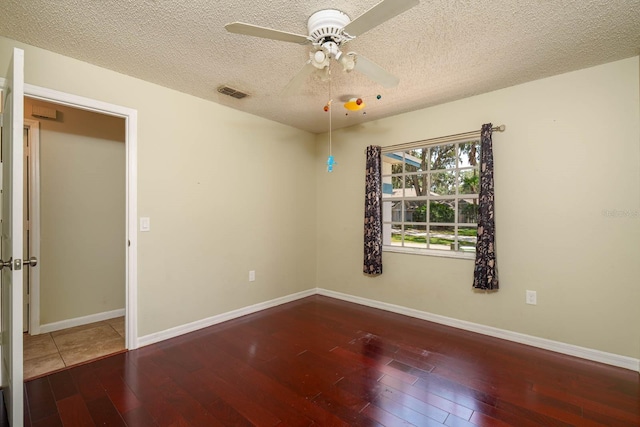 748 Sagewood Dr, Lakeland, FL 33813 - unfurnished room with a ceiling fan, hardwood / wood-style flooring, a textured ceiling, and baseboards