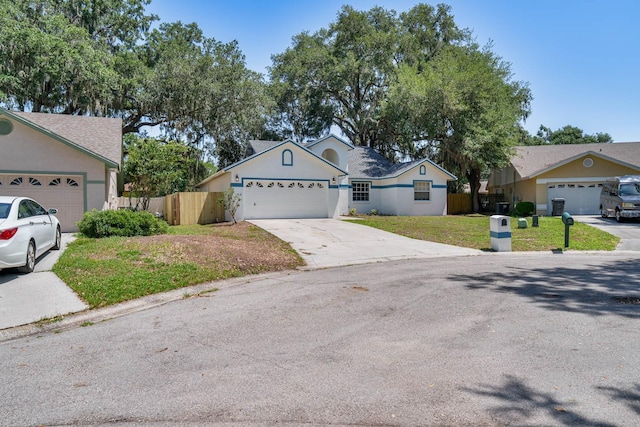 748 Sagewood Dr, Lakeland, FL 33813 - single story home featuring driveway, an attached garage, and stucco siding
