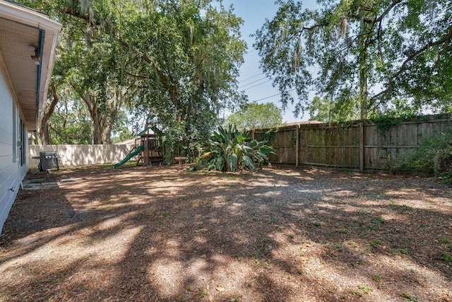 748 Sagewood Dr, Lakeland, FL 33813 - fenced backyard featuring a playground