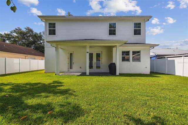 807 W Kentucky Ave, Tampa, FL 33603 - back of property featuring french doors and stucco siding