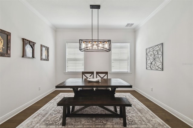 807 W Kentucky Ave, Tampa, FL 33603 - dining room with a chandelier, plenty of natural light, ornamental molding, and baseboards