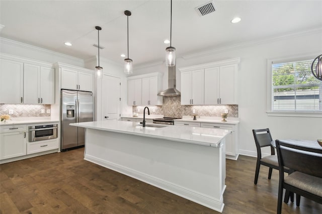 807 W Kentucky Ave, Tampa, FL 33603 - kitchen featuring appliances with stainless steel finishes, a sink, tasteful backsplash, crown molding, and light countertops
