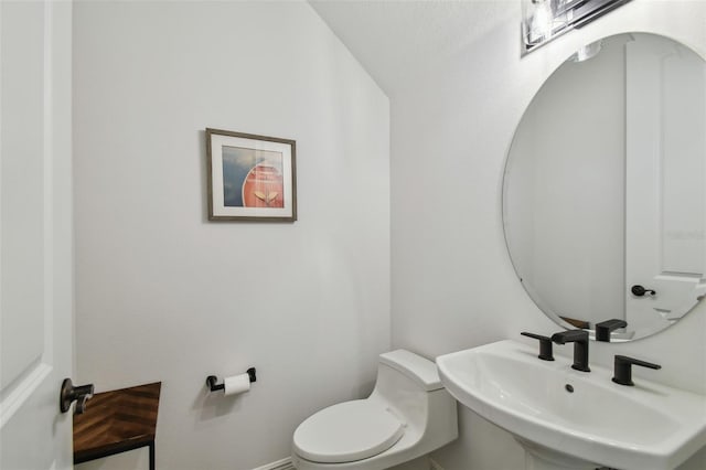 807 W Kentucky Ave, Tampa, FL 33603 - half bath featuring a sink and toilet