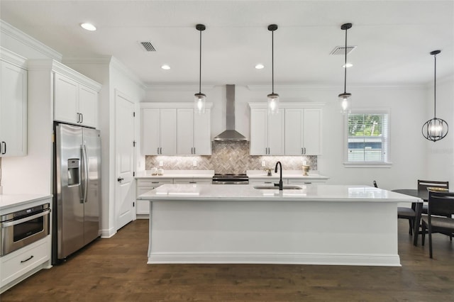 807 W Kentucky Ave, Tampa, FL 33603 - kitchen featuring appliances with stainless steel finishes, wall chimney range hood, a sink, decorative backsplash, and ornamental molding