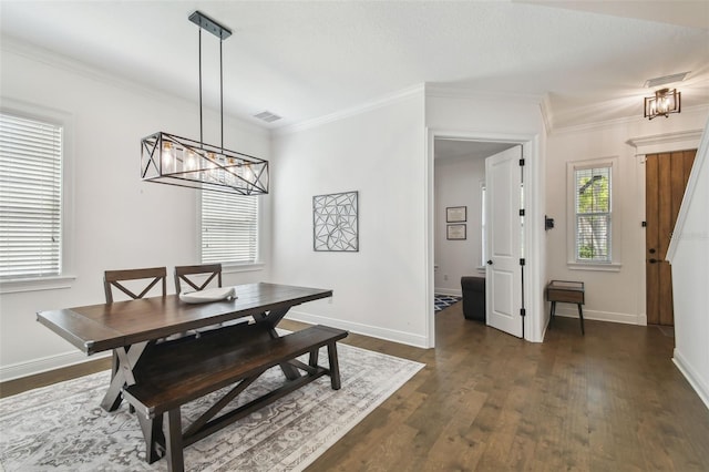 807 W Kentucky Ave, Tampa, FL 33603 - dining room with a chandelier, dark wood-type flooring, ornamental molding, and baseboards