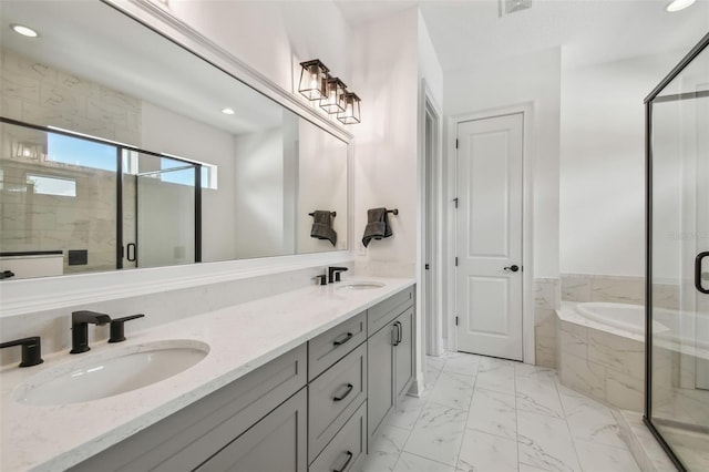 807 W Kentucky Ave, Tampa, FL 33603 - bathroom with a bath, a stall shower, marble look tile flooring, recessed lighting, and double vanity