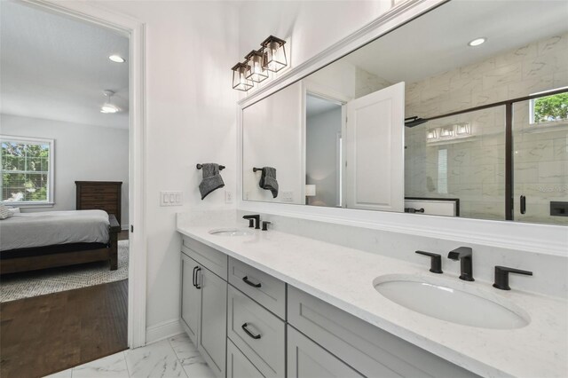 807 W Kentucky Ave, Tampa, FL 33603 - bathroom with marble finish floors, baseboards, a stall shower, ensuite bathroom, and recessed lighting