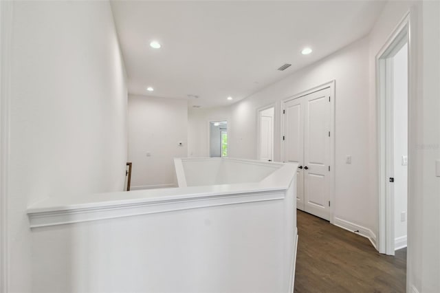 807 W Kentucky Ave, Tampa, FL 33603 - hallway featuring dark wood-type flooring, an upstairs landing, recessed lighting, and baseboards