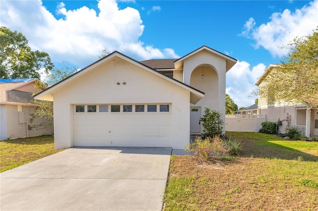 728 Waterbridge Dr, Winter Haven, FL 33880 - view of front of property with stucco siding, driveway, and a garage