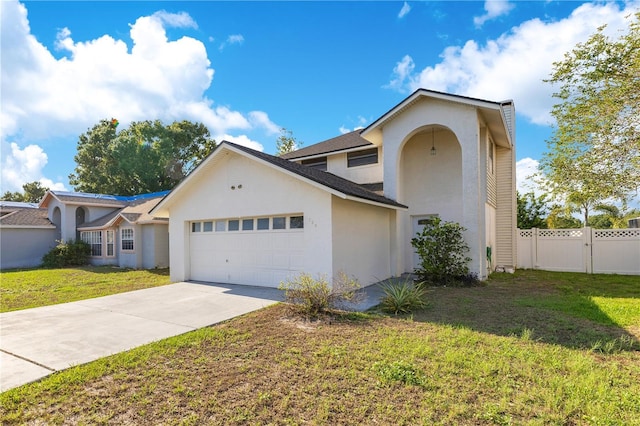 728 Waterbridge Dr, Winter Haven, FL 33880 - traditional home featuring stucco siding, an attached garage, and driveway