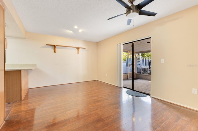 728 Waterbridge Dr, Winter Haven, FL 33880 - spare room with wood finished floors, a ceiling fan, baseboards, a textured ceiling, and recessed lighting
