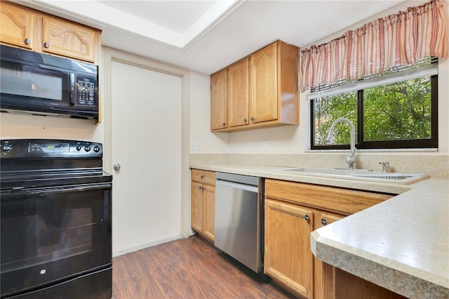 728 Waterbridge Dr, Winter Haven, FL 33880 - kitchen with black appliances, a sink, dark wood-style flooring, and light countertops