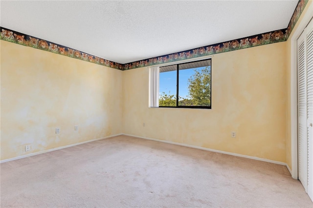 728 Waterbridge Dr, Winter Haven, FL 33880 - spare room with carpet floors, baseboards, and a textured ceiling