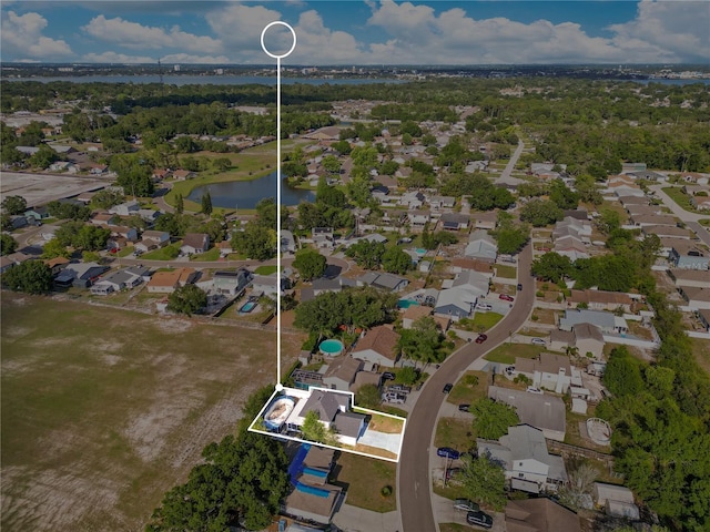 728 Waterbridge Dr, Winter Haven, FL 33880 - aerial view of property and surrounding area featuring a large body of water, property boundaries highlighted, and nearby suburban area
