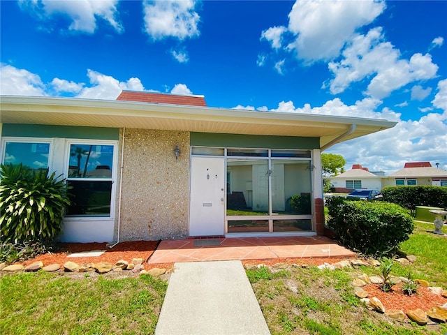 4351 Tahitian Gardens Cir Unit H, Holiday, FL 34691 - property entrance featuring stucco siding