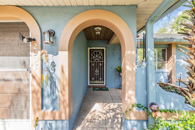 2308 Rio Cir, Spring Hill, FL 34608 - entrance to property with stucco siding and a porch