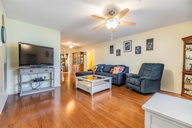 2308 Rio Cir, Spring Hill, FL 34608 - living area featuring ceiling fan and wood finished floors