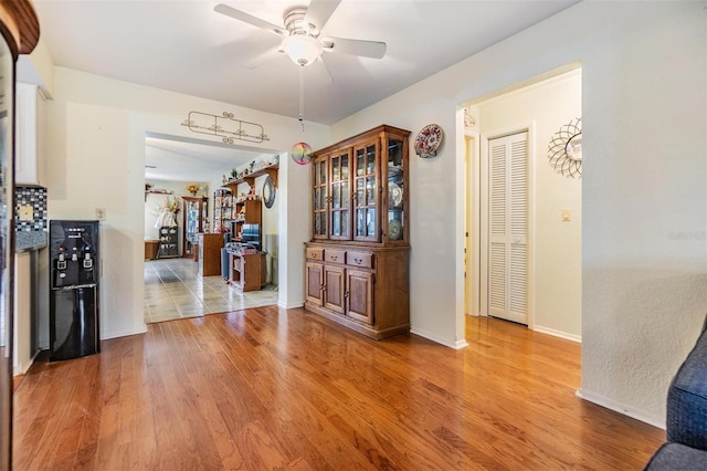 2308 Rio Cir, Spring Hill, FL 34608 - dining area featuring a ceiling fan, light wood-style flooring, and baseboards