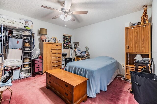 2308 Rio Cir, Spring Hill, FL 34608 - bedroom featuring carpet floors, a textured ceiling, and a ceiling fan