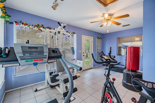 2308 Rio Cir, Spring Hill, FL 34608 - exercise room featuring ceiling fan and baseboards